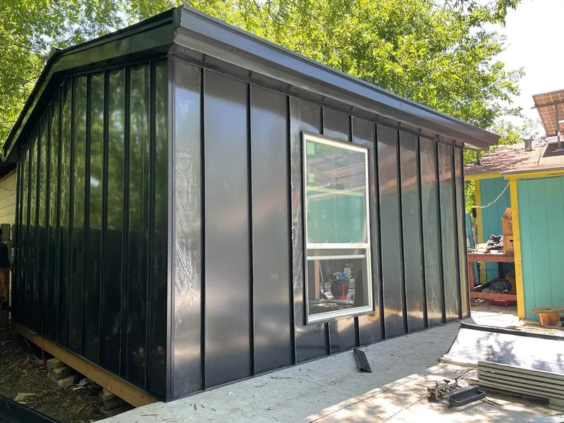 Black standing seam metal wall panels for Roof Inspection in Gaines