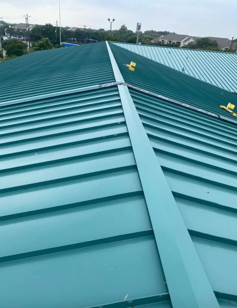 Green commercial metal roof ridge and valley for Metal Roof Repair in Gaines
